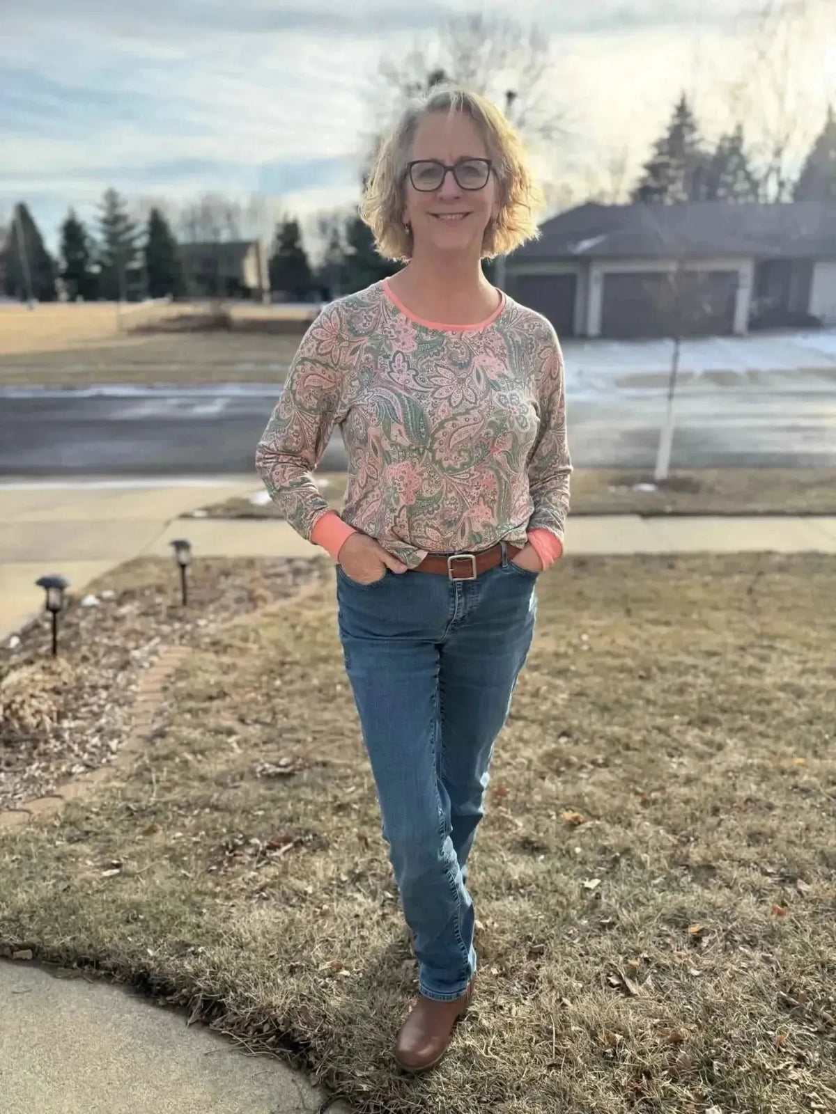 Pink and green paisley maze boho fabric with intricate swirling patterns.