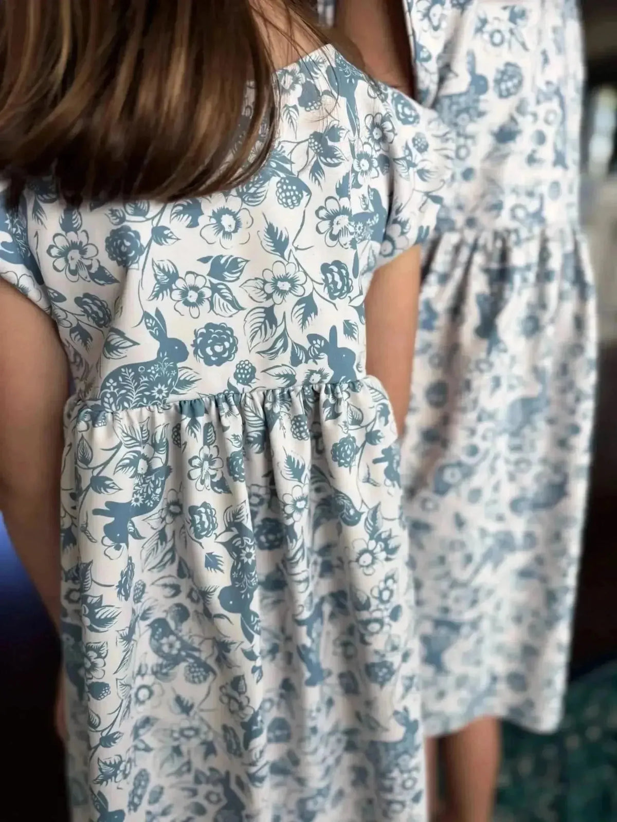 Carolina blue fabric with bunny and bramble print, sold by the yard.