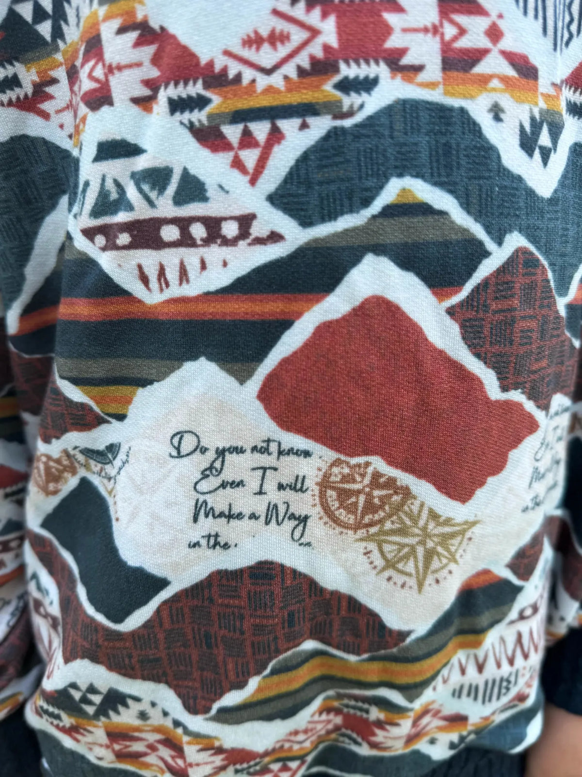 Fabric with a colorful mountain pattern and the text "Do you not know Even I will Make a Way".