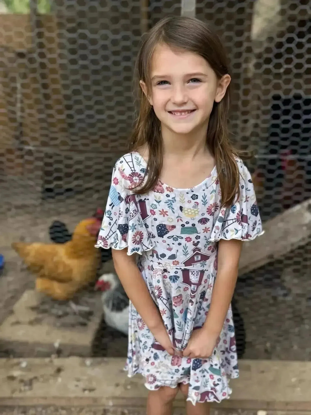 Barnyard farm animals print fabric with chickens, barns, and patterns.