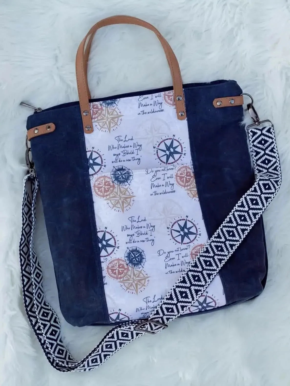 Blue and brown compass print fabric with nautical motifs and text overlays.