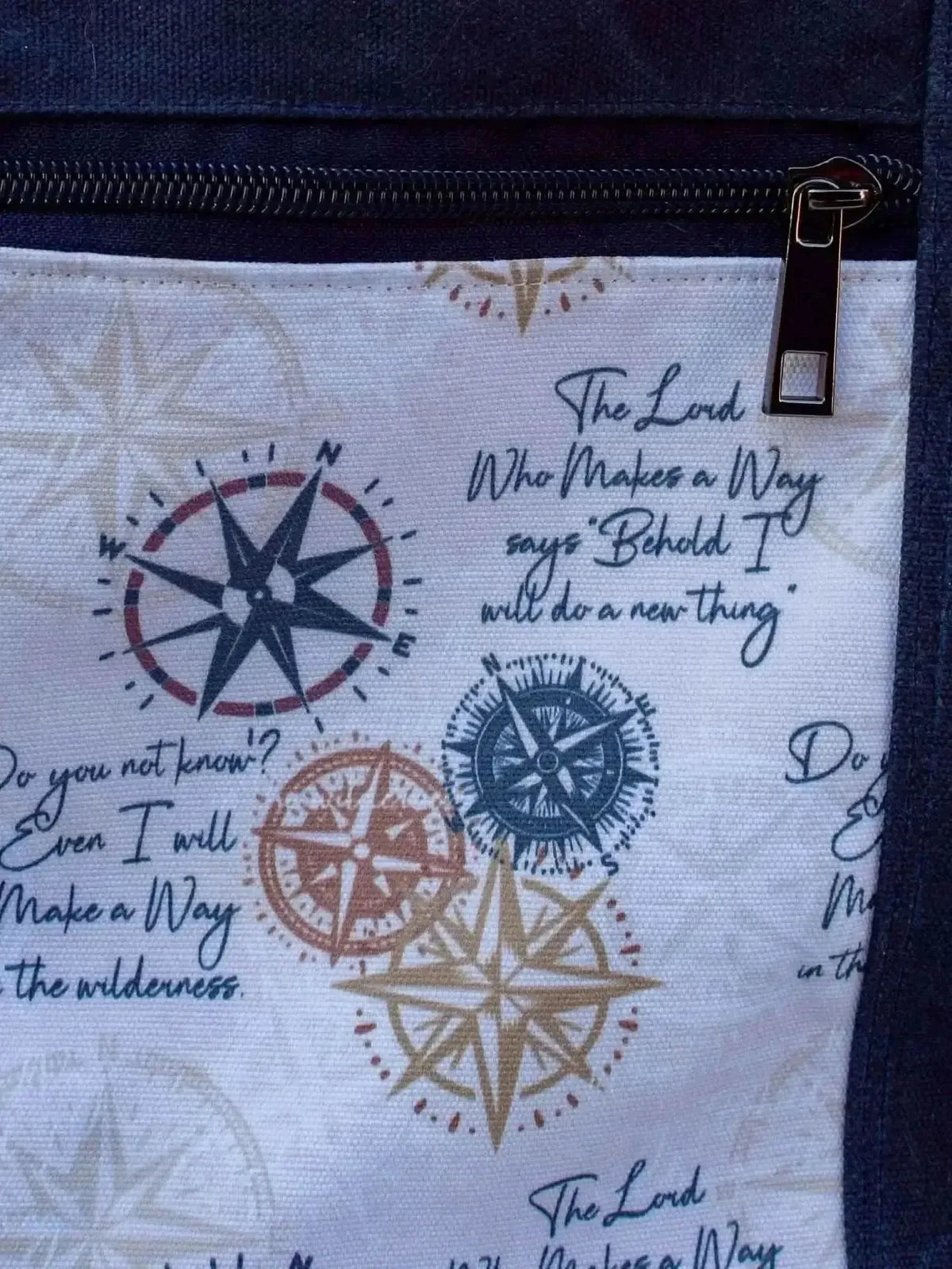 Blue and brown compass print fabric with Isaiah 43:19 Bible verse.