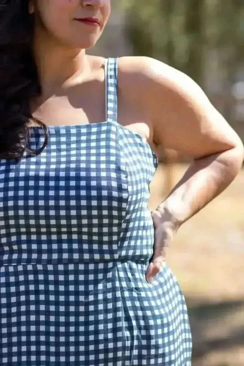 Navy gingham fabric with white checkered pattern on a woven base.