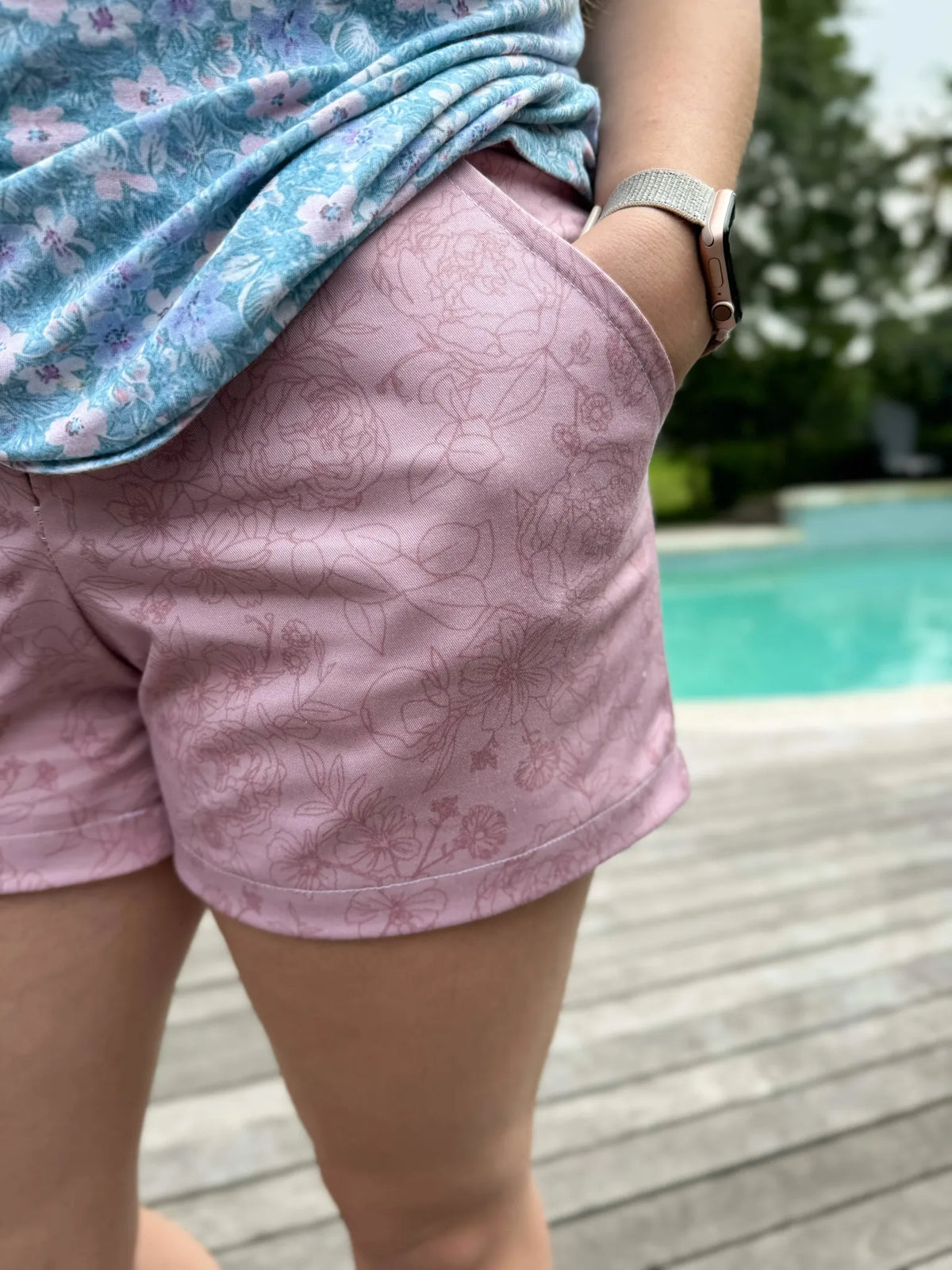 Mauve Stenciled Floral fabric shorts with a light blue floral top.