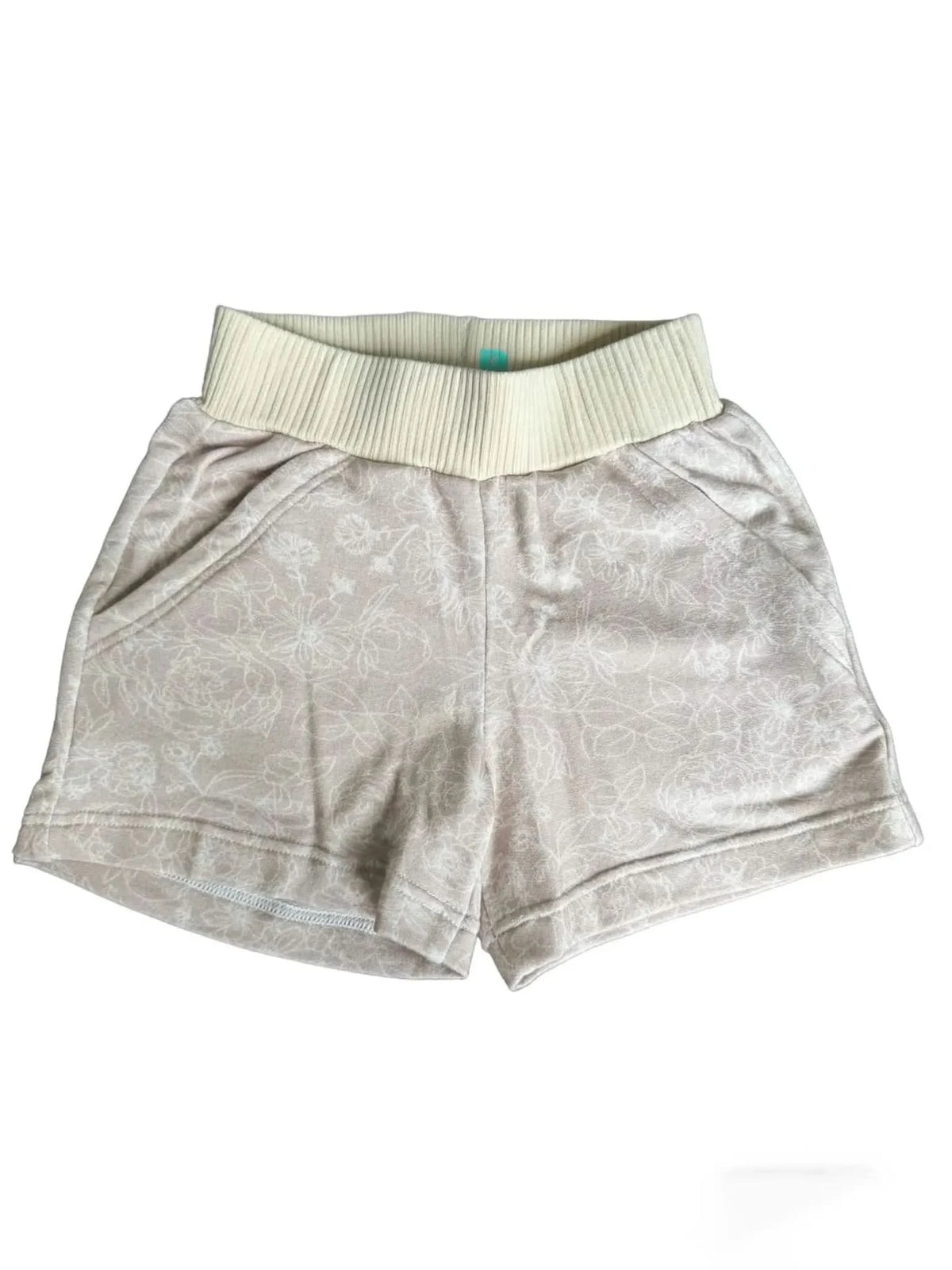 Tan shorts with a white floral stencil pattern and a ribbed waistband.