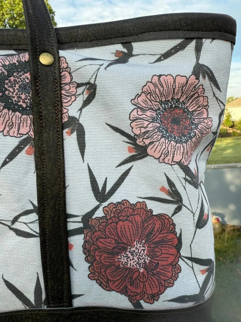 Twilight Bramble floral fabric with pink flowers and black bamboo on white background.