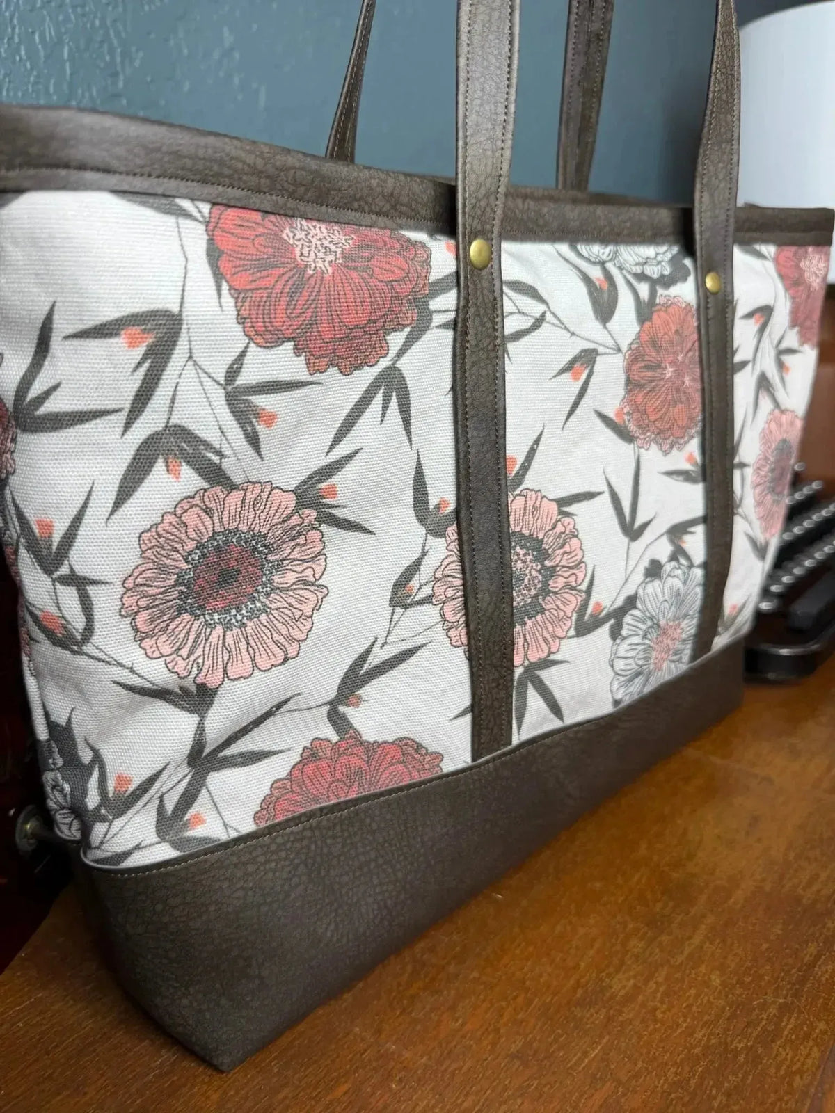 Twilight Bramble Floral Fabric with pink flowers and bamboo on white base.