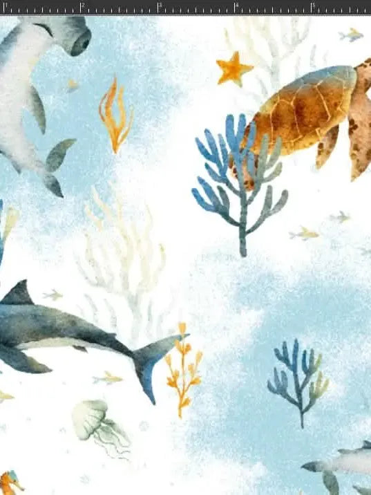 Fabric with a watercolor-style underwater scene featuring sharks, a turtle, and coral.