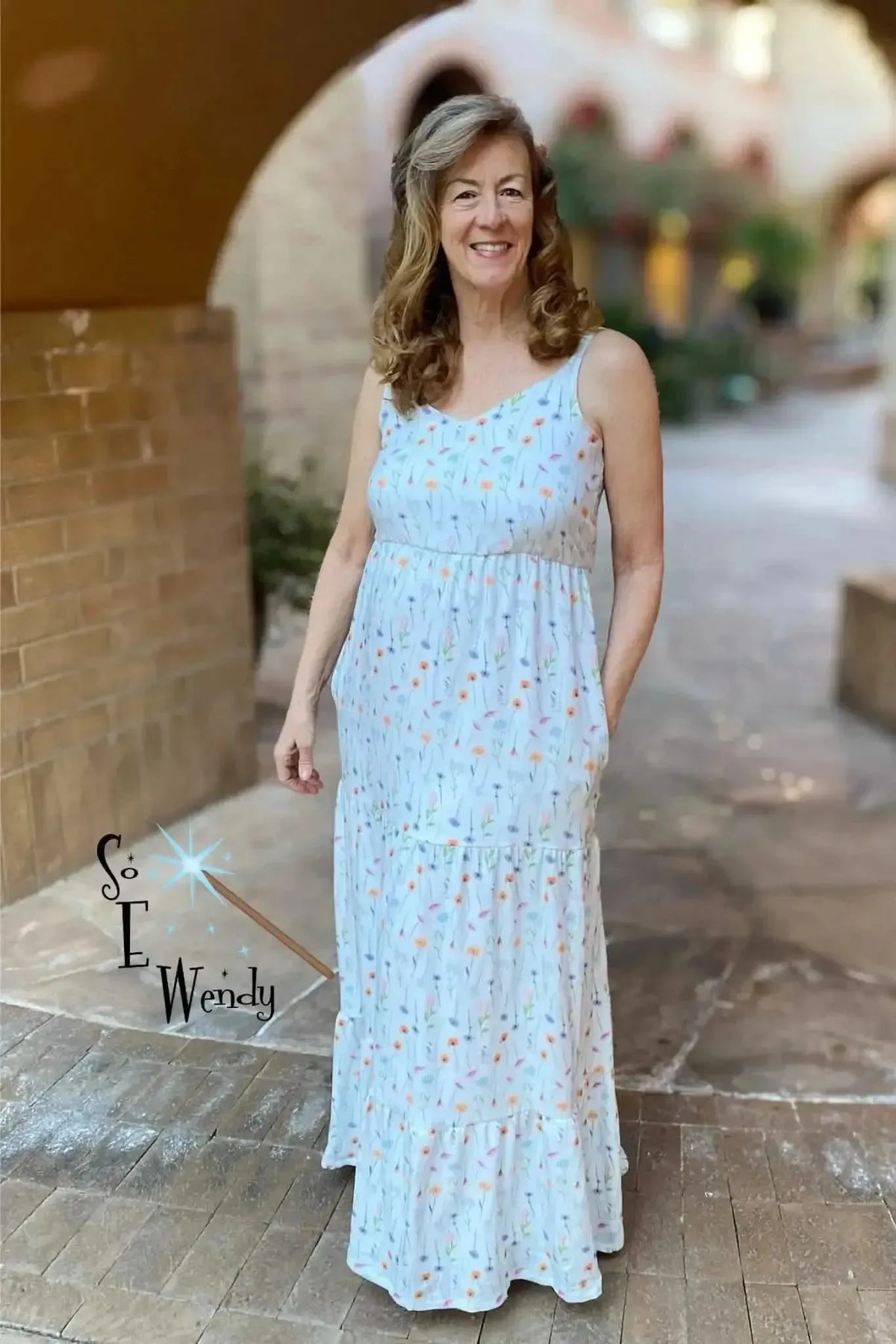 Wildflowers printed fabric with botanical floral design in white and orange tones.