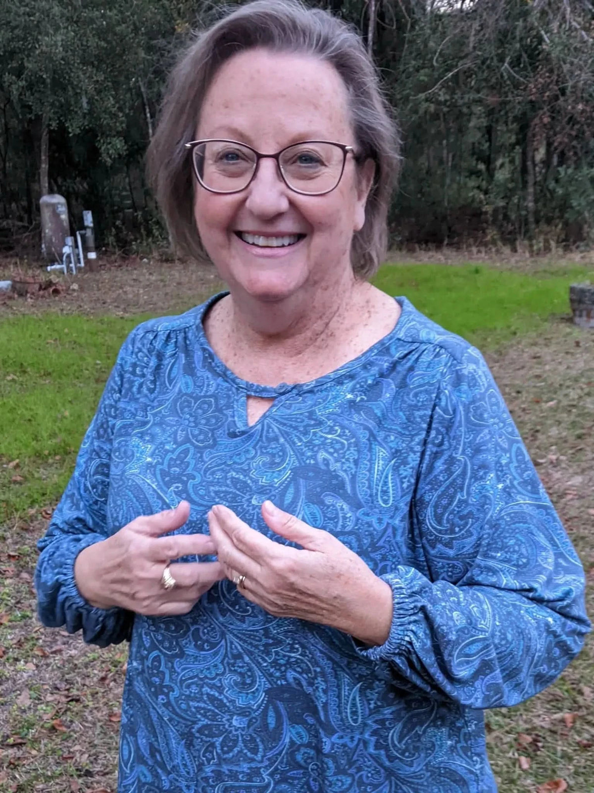 Blue Paisley Maze fabric on a woman's long-sleeved shirt.