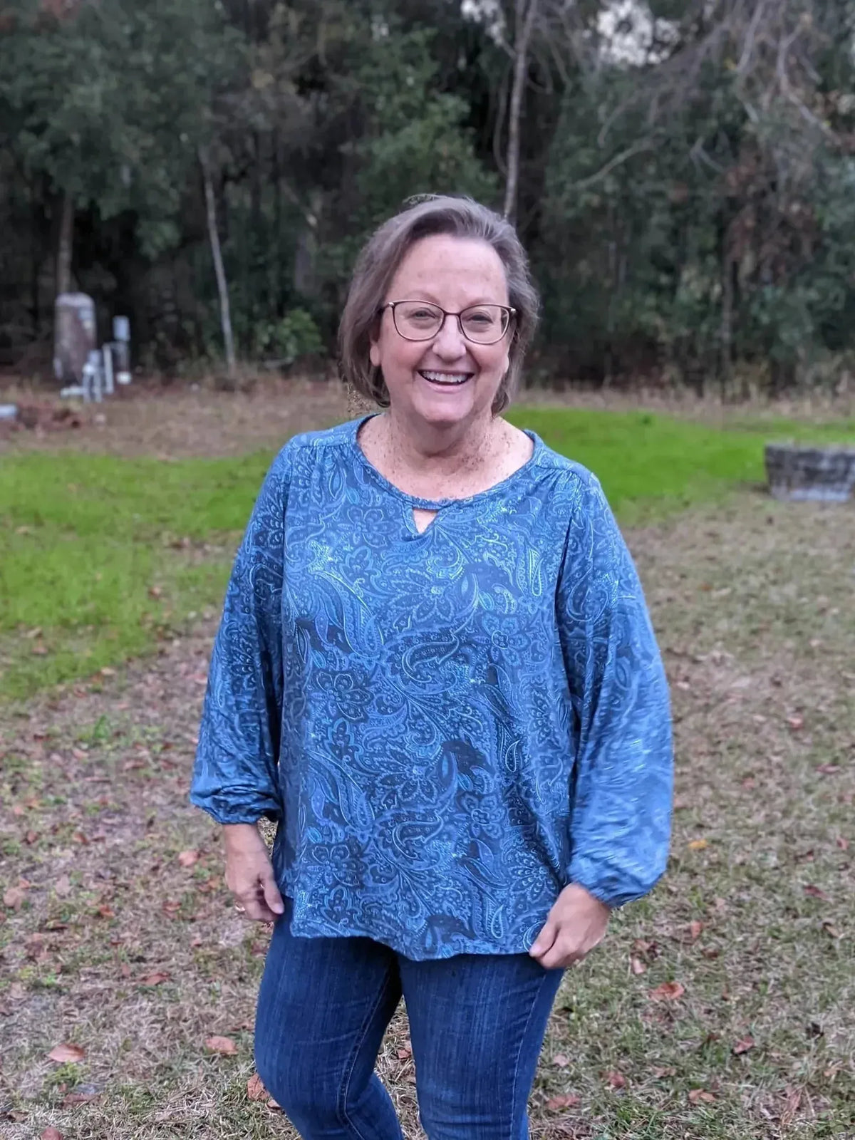 Blue paisley maze patterned fabric sewn into a woman's long-sleeved blouse.