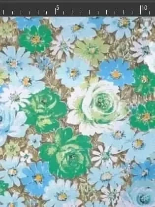 Floral print fabric with blue, green, and white flowers on a brown background.