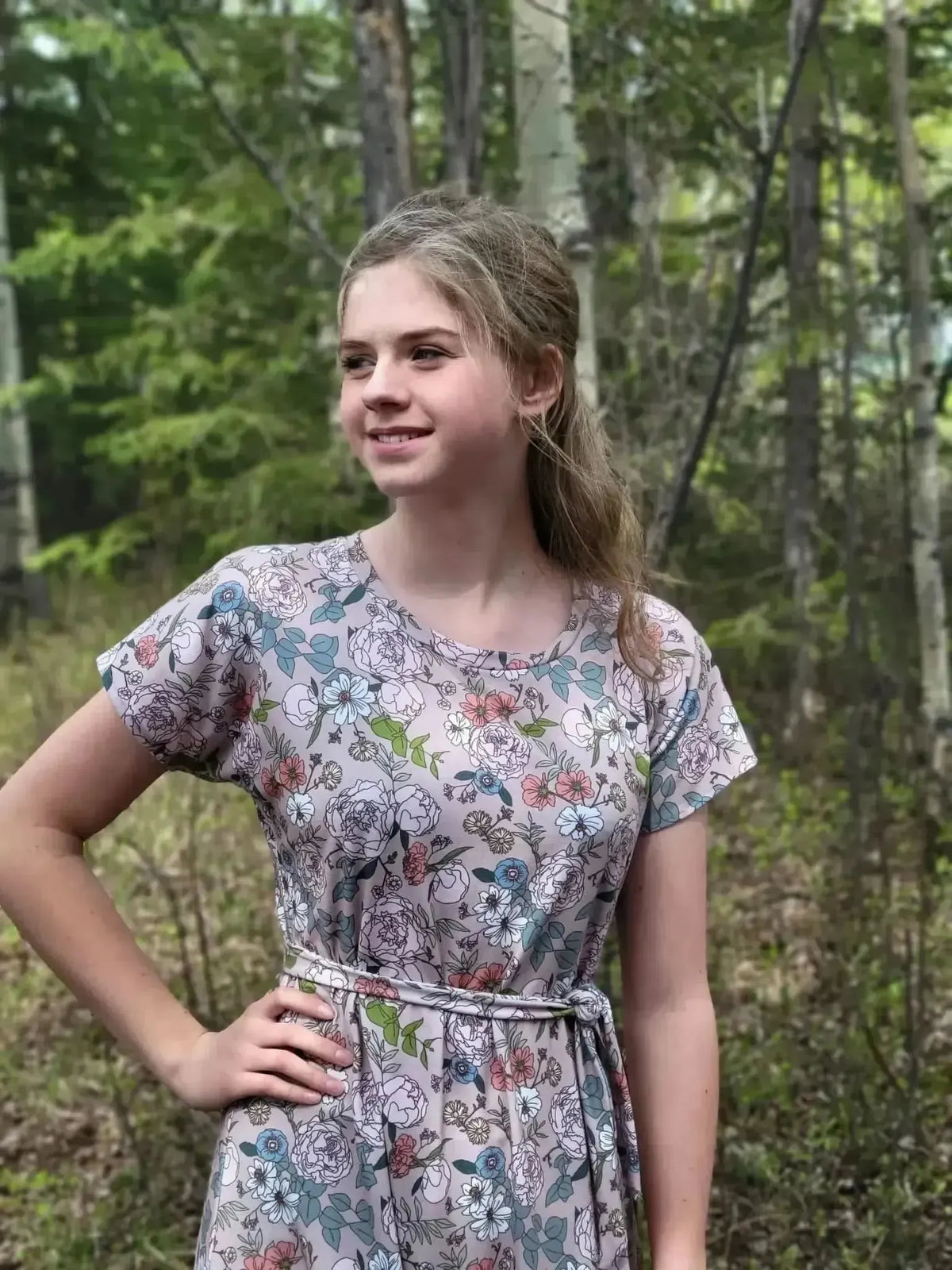 Tan Japanese floral fabric with pink and green blooms on a neutral background.