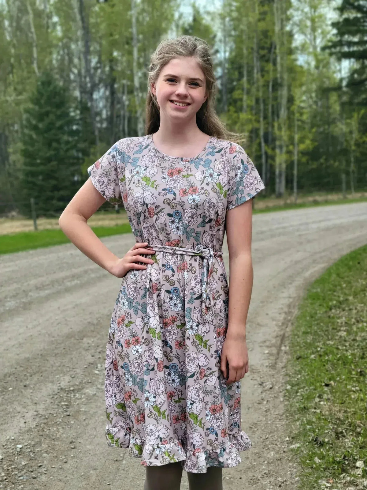Tan Japanese floral fabric with pink and green flowers on a light background.