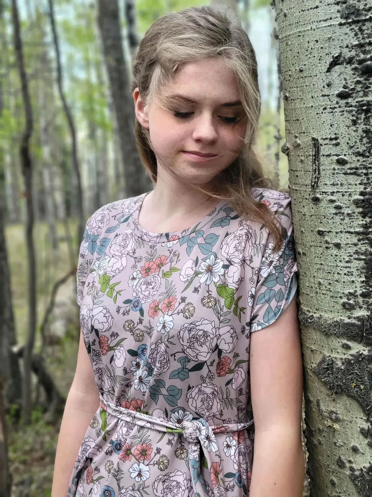 Tan Japanese floral fabric with pink and green flowers on a beige background.