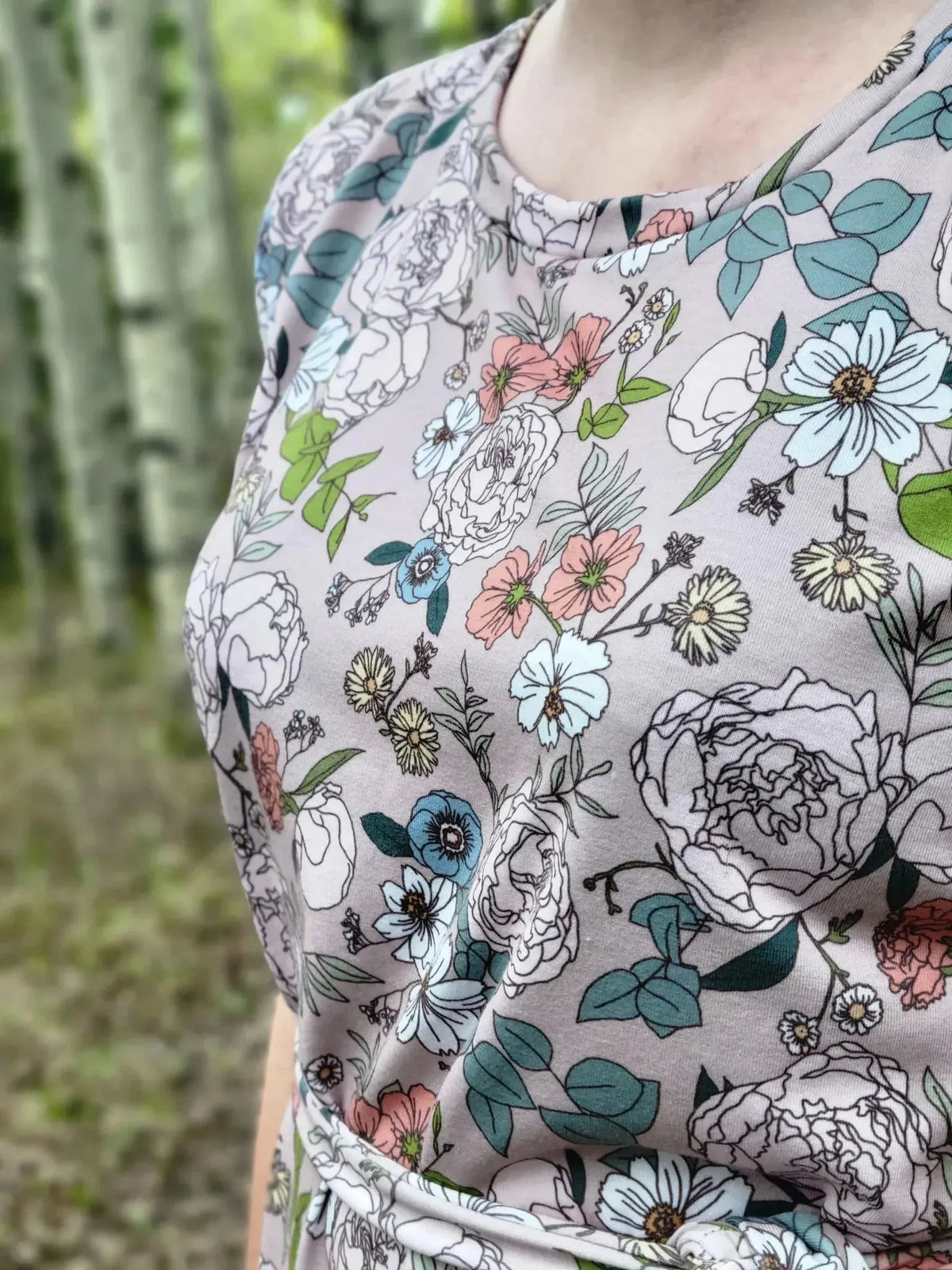 Tan Japanese floral fabric with white, pink, and blue flowers on a light tan background.