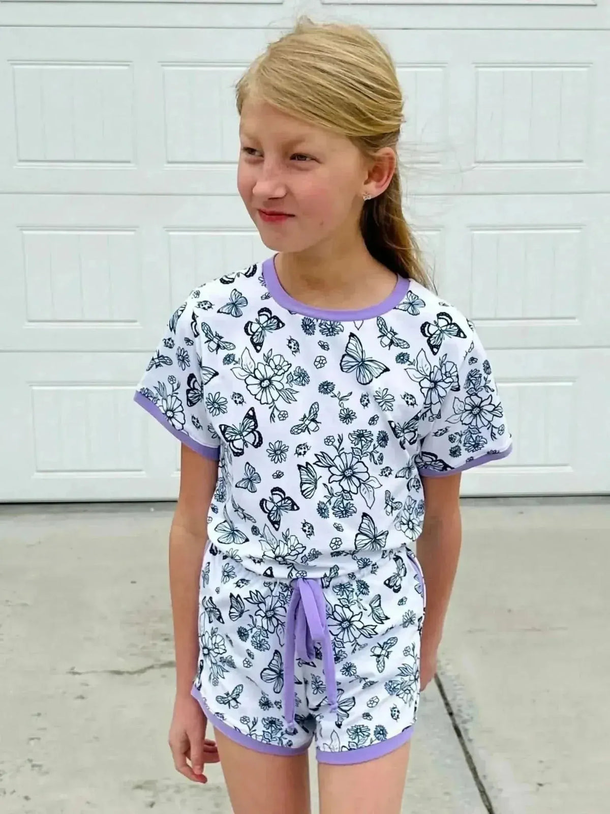 White fabric with color-your-own black-line butterfly print.