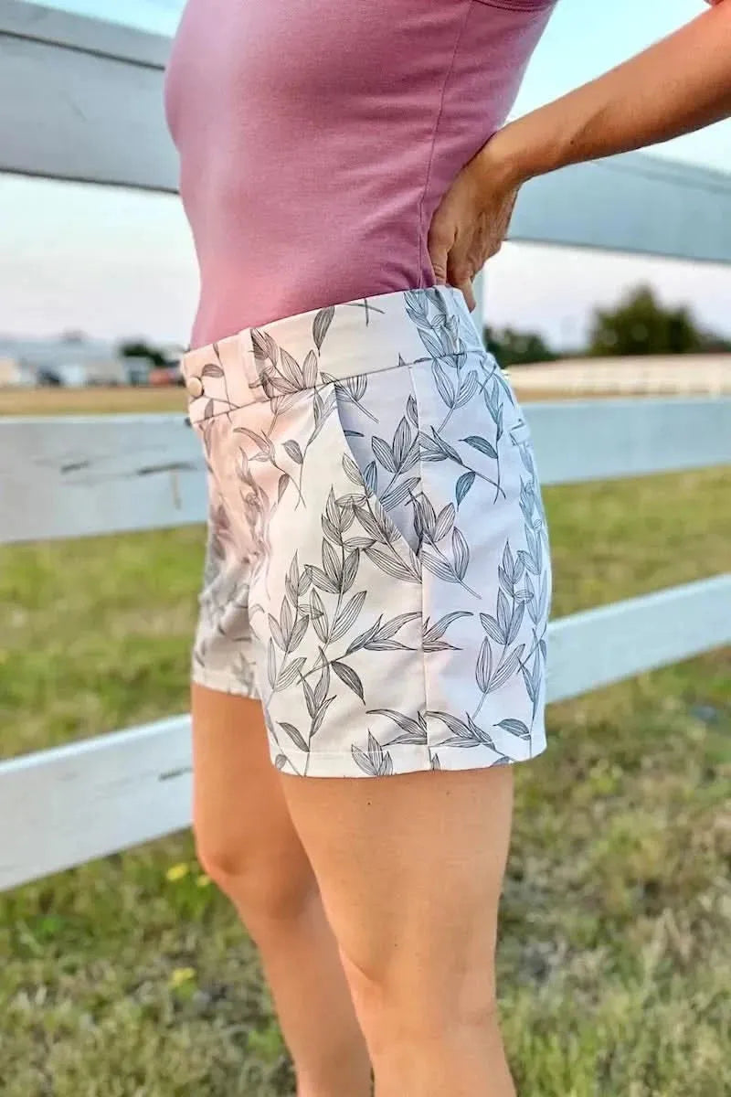 Grey foliage botanical fabric with leaf print on white base.