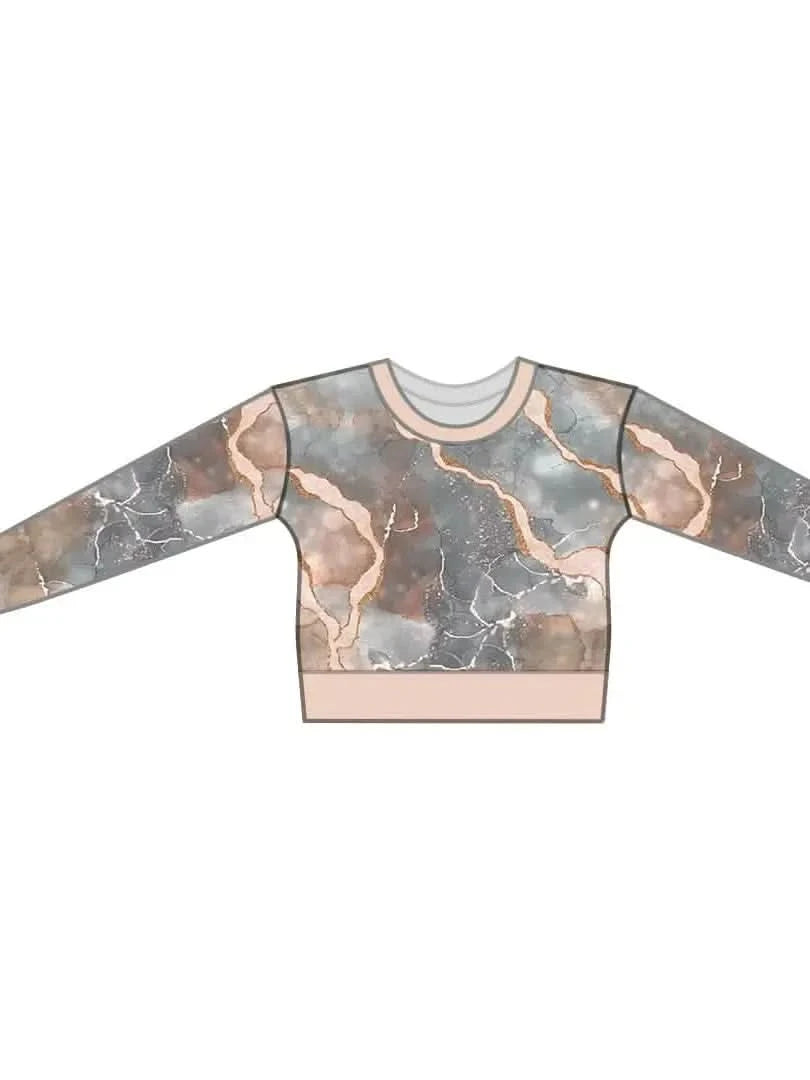 Pink marble pattern long-sleeve top with light pink trim.